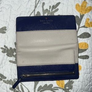 Kate spade Slim Bifold wallet. Used. Has a spot